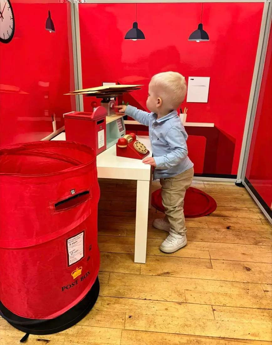 Child enjoying a Toddler Town role play session